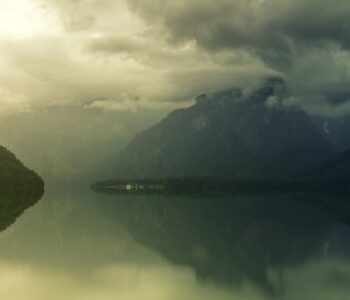 A mountain lake at sunrise, evoking a deep Brainspotting and IFS therapy intensive