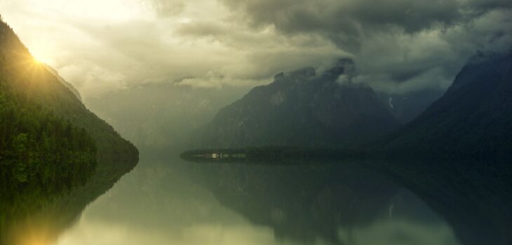 A mountain lake at sunrise, evoking a deep Brainspotting and IFS therapy intensive